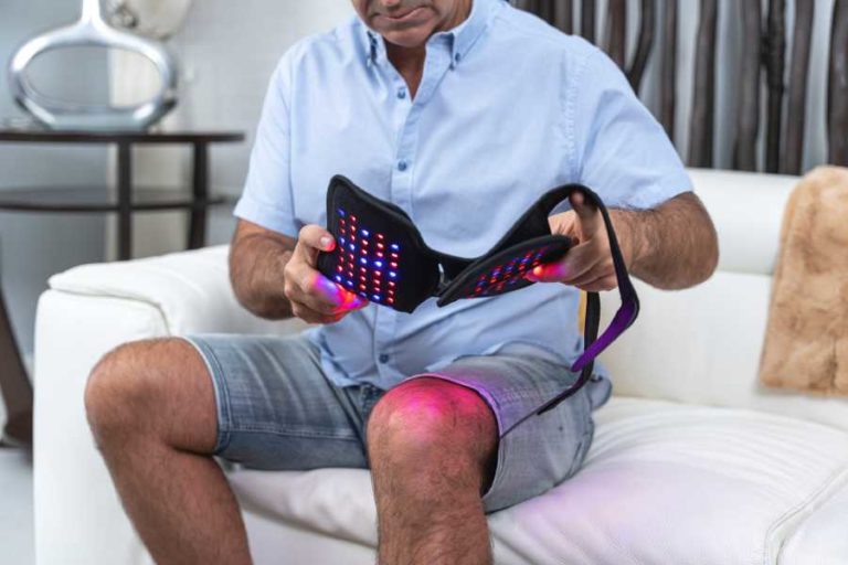 Person looking at OnLux Knee Pad with the lights on.